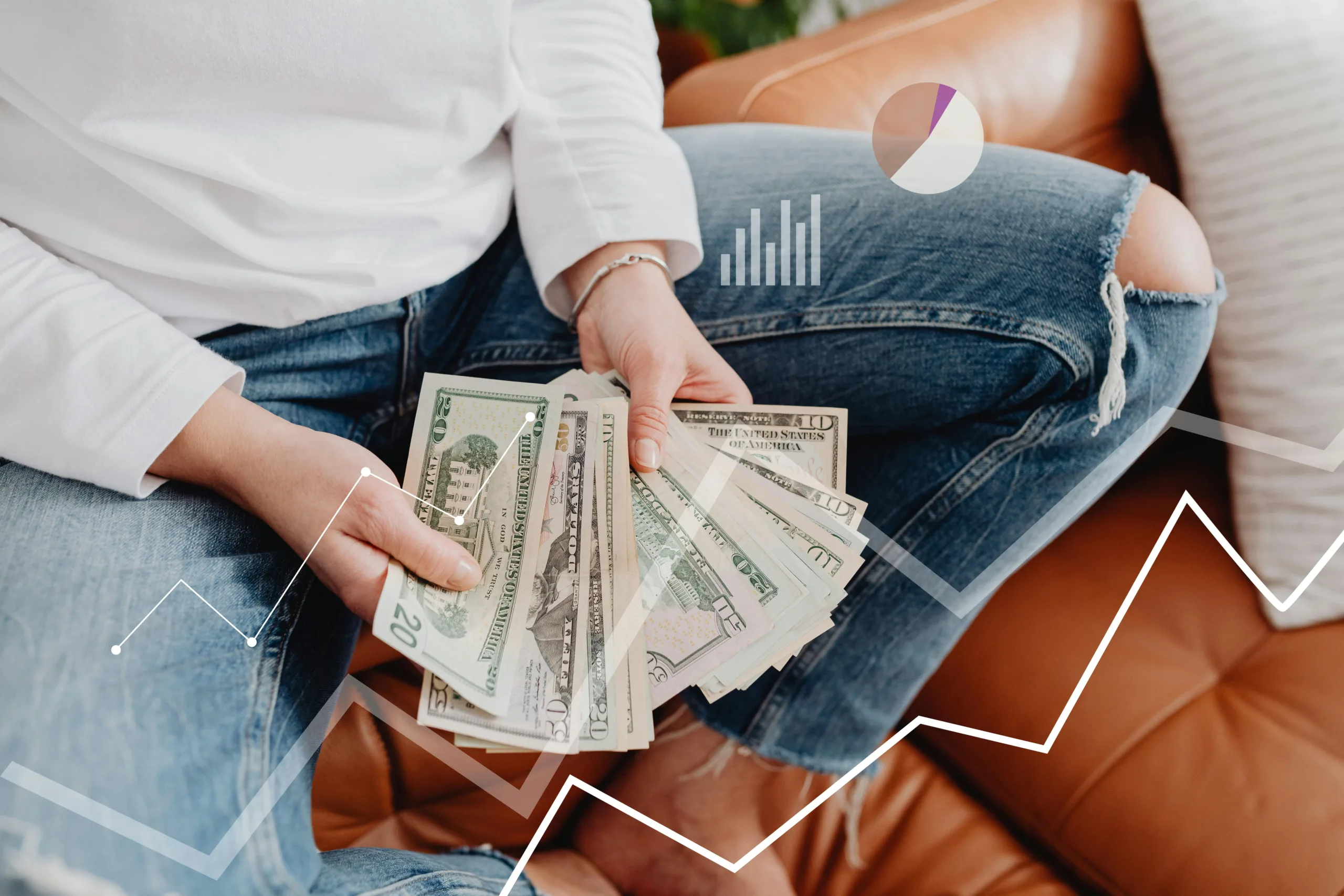 Woman sitting with a lots of US dollars in her hands and graphs overlayed across the image.